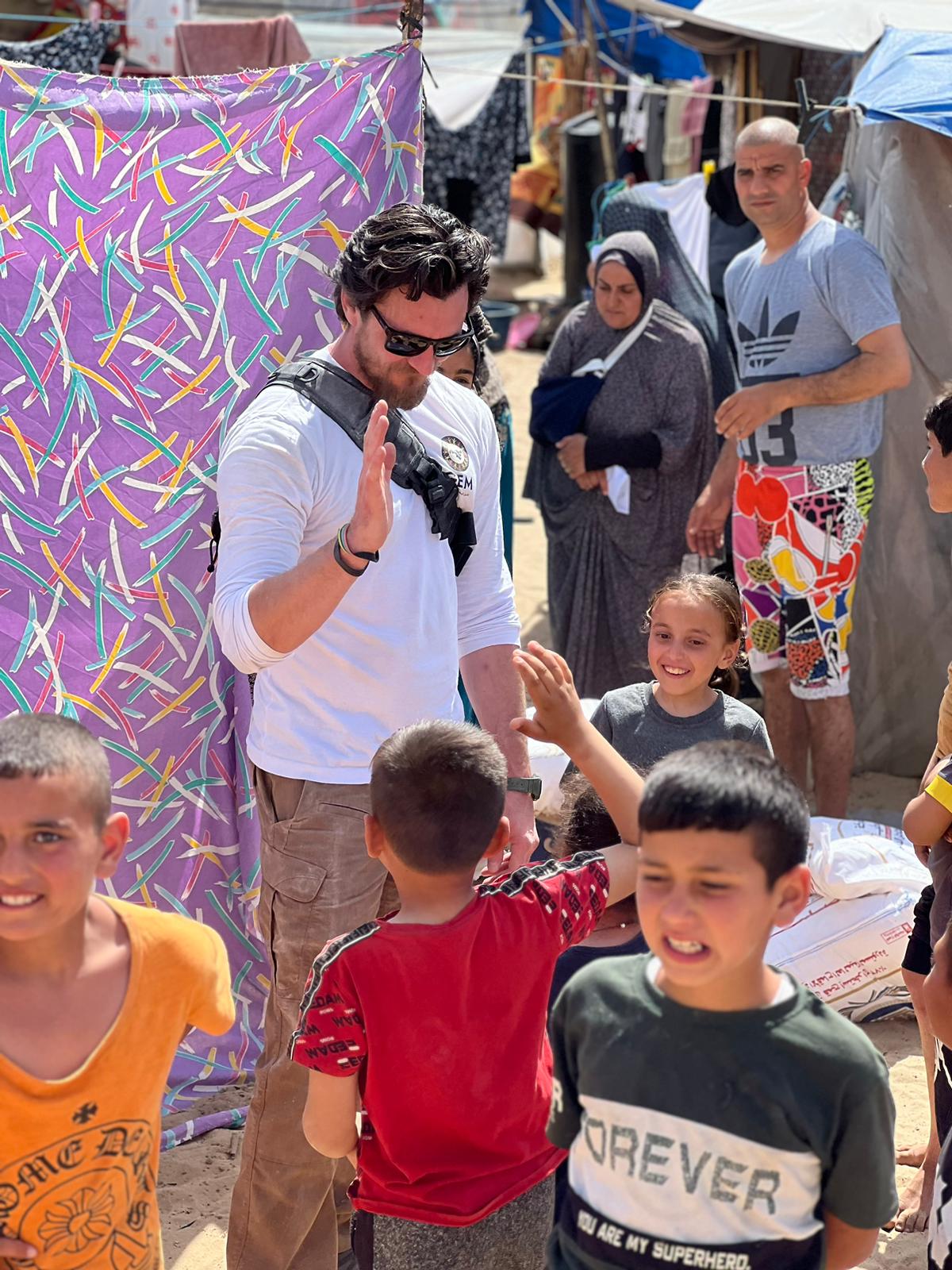 Paul Wagner with a child in Gaza, 2024